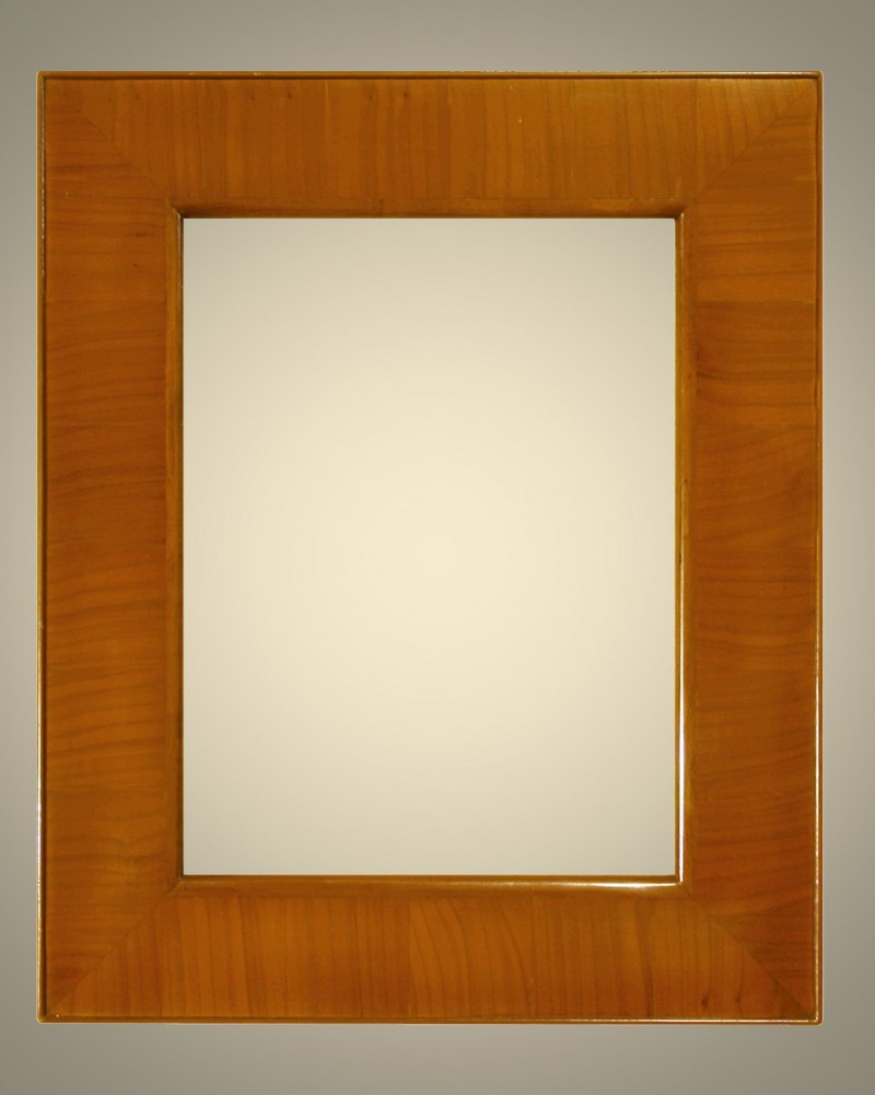 Cornici Lastronate - 300/7 - Cornice lastronata in legno di ciliegio nazionale. levigata e verniciata a mano, lucidata con cere e patine naturali.&nbsp; Oltre che nelle misure standard, questo modello Ã¨ disponibile anche in misure a richiesta. Caratteristiche tecniche:Larghezza: mm 90Altezza: mm 27Altezza Battuta: mm 11 - Cornici artigianali - Casa d'Arte - Bra (CN)