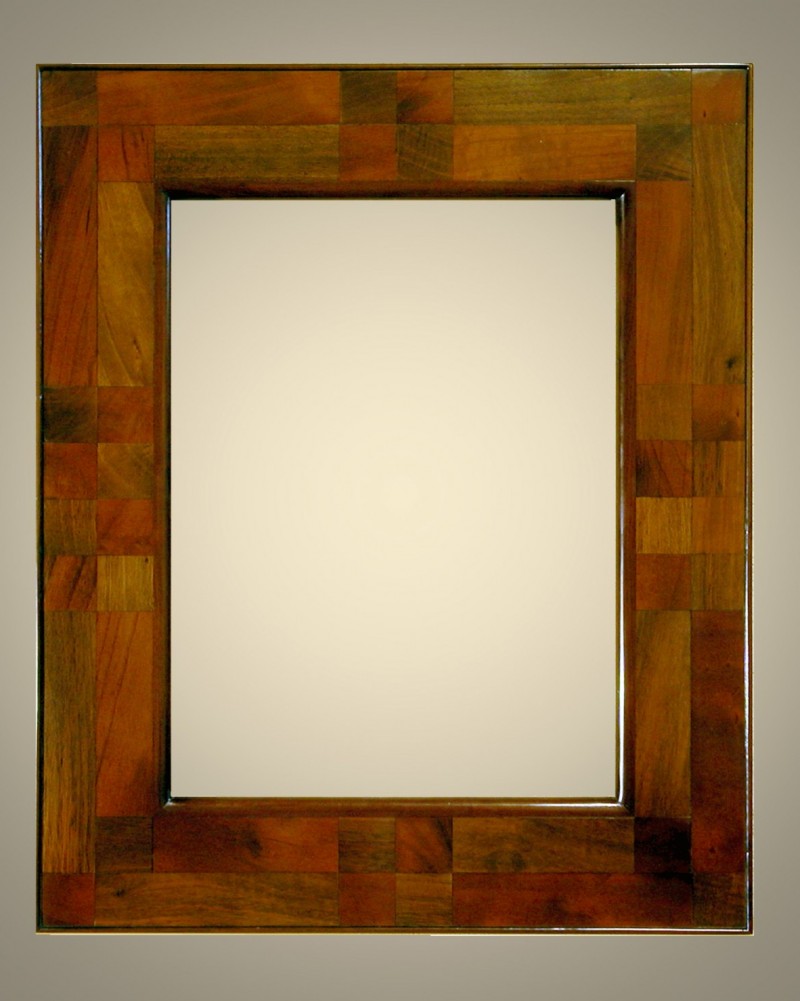 Cornici Lastronate - 134/7 - Cornice lastronata in legno di noce nazionale e ciliegio nazionale. levigata e verniciata a mano, lucidata con cere e patine naturali.  Oltre che nelle misure standard, questo modello Ã¨ disponibile anche in misure a richiesta. Caratteristiche tecniche:Larghezza: mm 90Altezza: mm 27Altezza Battuta: mm 11 - Cornici artigianali - Casa d'Arte - Bra (CN)